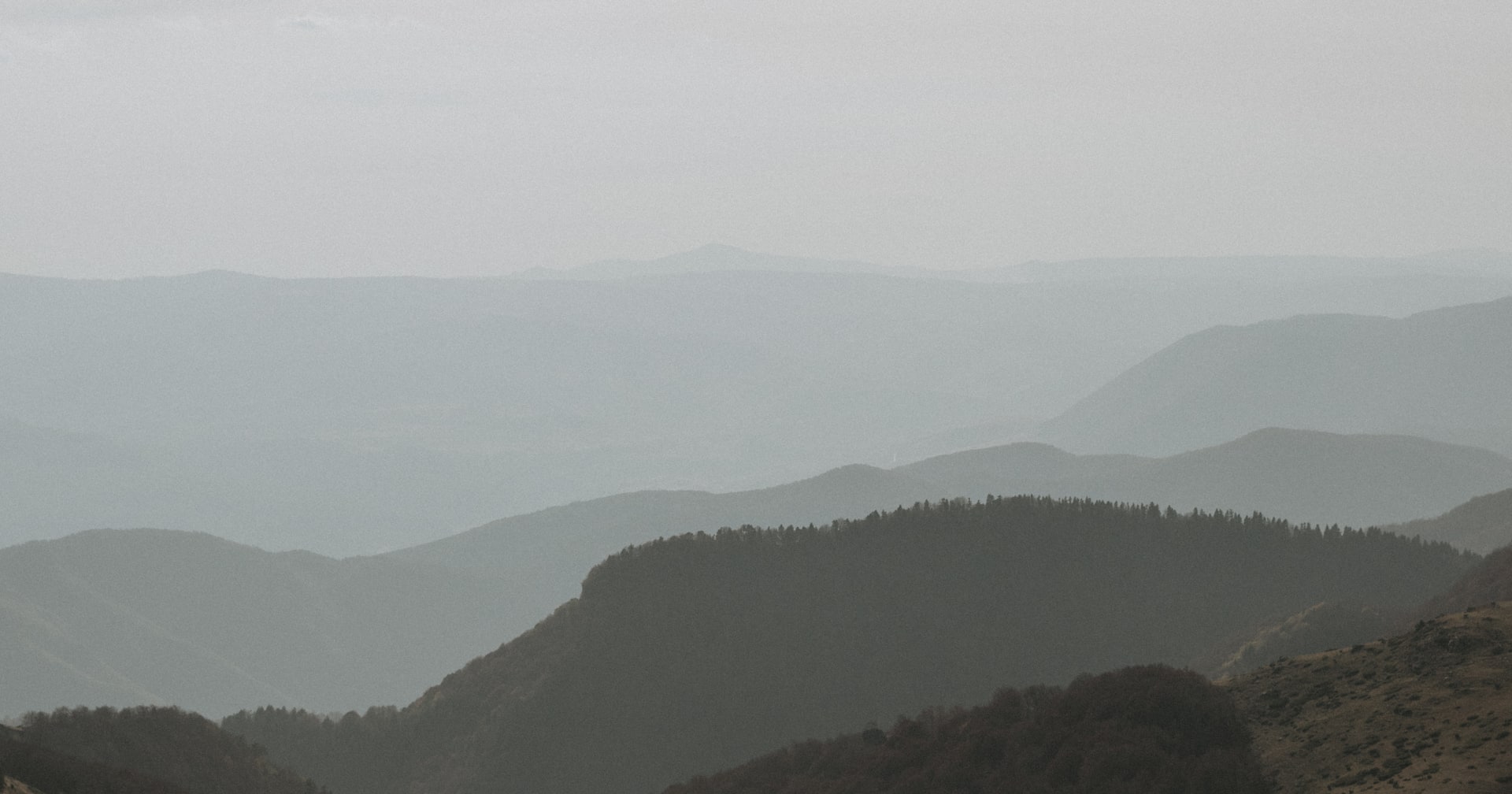 Layers of misty hills fading into the horizon